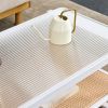 Modern minimalist white double layered solid wood coffee table. Glass tabletop, imitation rattan edge table. Rectangular table suitable for living roo